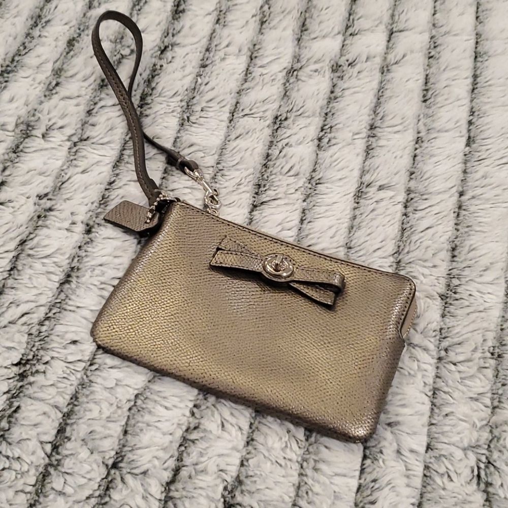 Cute metallic Coach bow wristlet